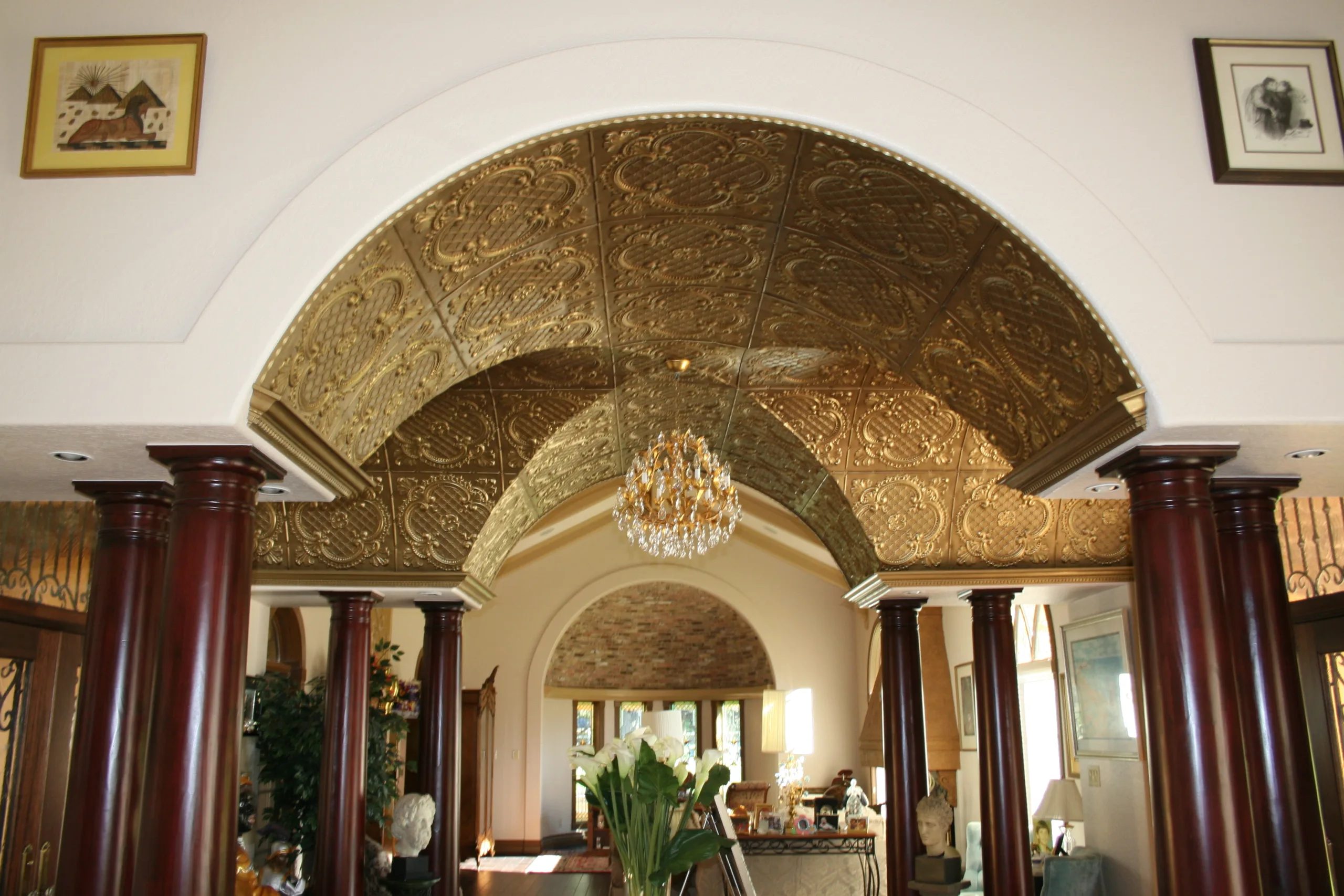 Ornate architectural archway featuring decorative carved detailing, curved ceiling, and elegant columns by Artchitectural in San Antonio, Texas.